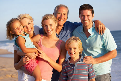Grandparents, mother and father and children on the beach
